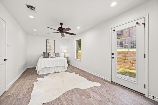 bedroom with ceiling fan, access to outside, and light hardwood / wood-style flooring