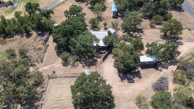 birds eye view of property with a rural view