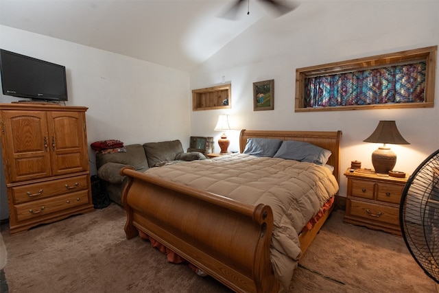 carpeted bedroom with ceiling fan and vaulted ceiling