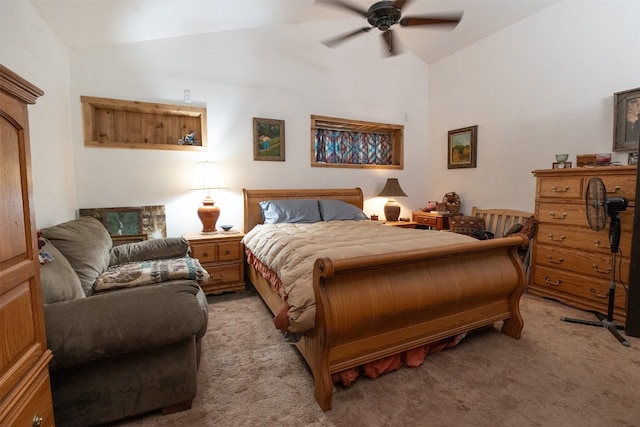 carpeted bedroom featuring ceiling fan and vaulted ceiling