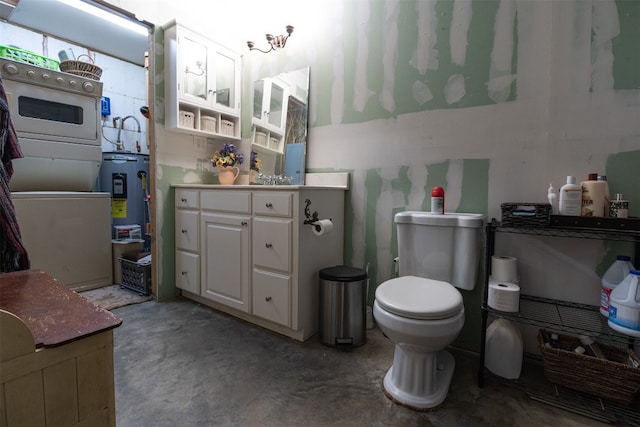 bathroom with toilet, concrete floors, electric water heater, and vanity