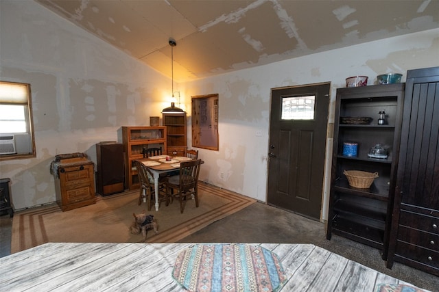 dining room with carpet flooring, cooling unit, and lofted ceiling