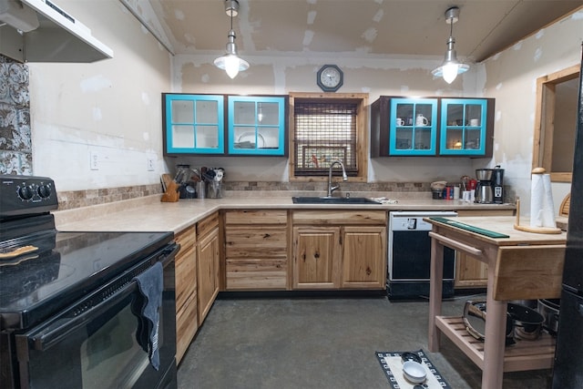 kitchen featuring sink, extractor fan, pendant lighting, and black appliances