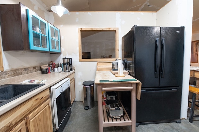 kitchen with concrete floors and black appliances