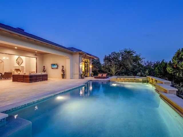 view of swimming pool with a patio area, outdoor lounge area, and a hot tub