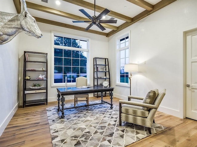 office area with beam ceiling, baseboards, and wood finished floors