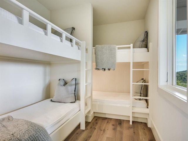 bedroom with wood finished floors