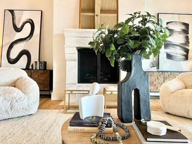 sitting room featuring a fireplace and wood finished floors