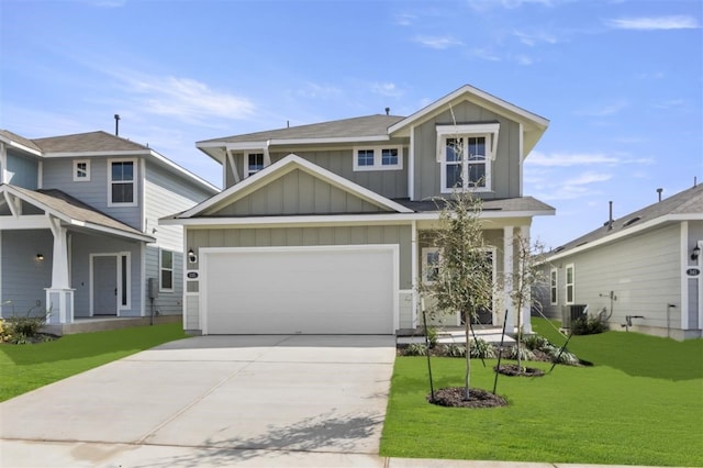 view of front of house with a garage, central air condition unit, and a front yard