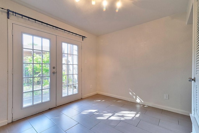 3465 Willowrun Dr, Austin, TX 78704 - entryway featuring baseboards, french doors, and tile patterned flooring