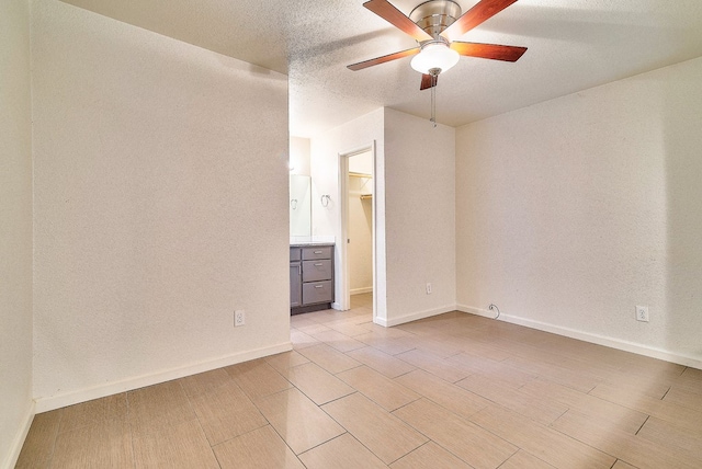 empty room featuring ceiling fan