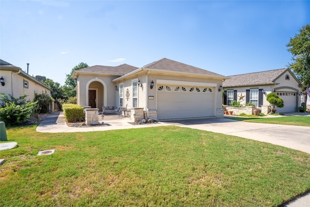 view of front of house featuring a garage and a front yard