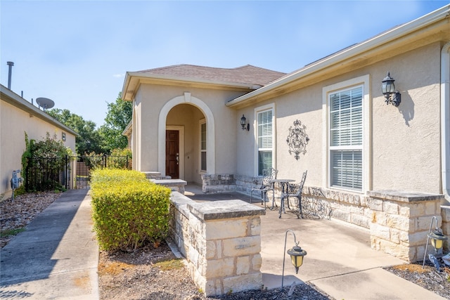 entrance to property with a patio