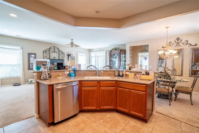 kitchen with sink, dishwasher, a healthy amount of sunlight, and light tile patterned floors