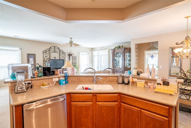 kitchen with carpet, plenty of natural light, sink, and dishwasher