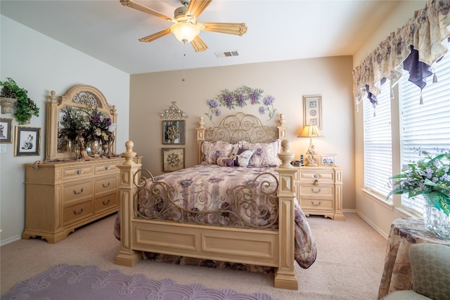 bedroom featuring ceiling fan and light colored carpet