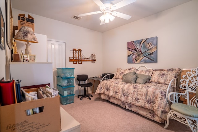 bedroom with ceiling fan, a closet, and carpet floors