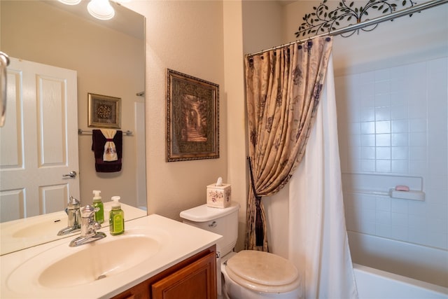 full bathroom with vanity, shower / tub combo, and toilet