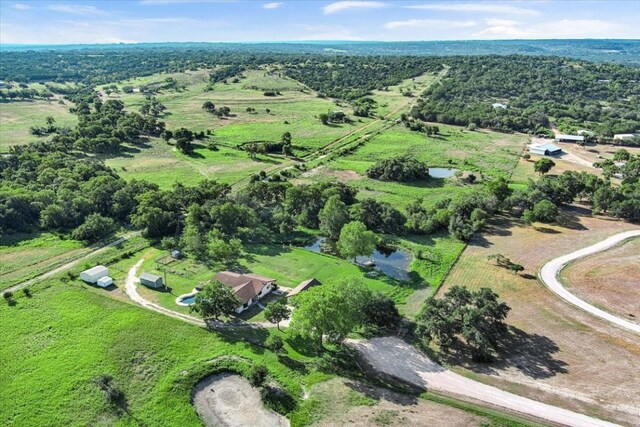 birds eye view of property featuring a rural view