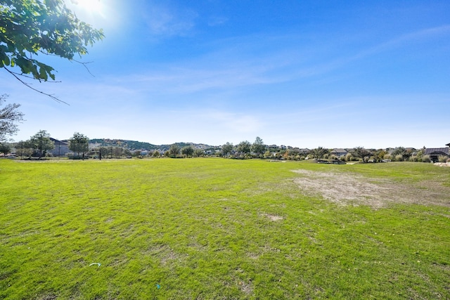 view of yard with a rural view