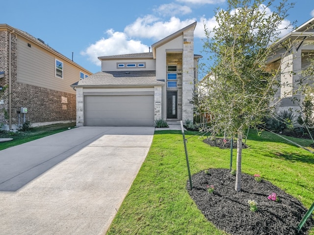 view of front facade featuring a front yard and a garage