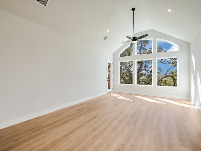 unfurnished living room with ceiling fan, light hardwood / wood-style floors, and high vaulted ceiling