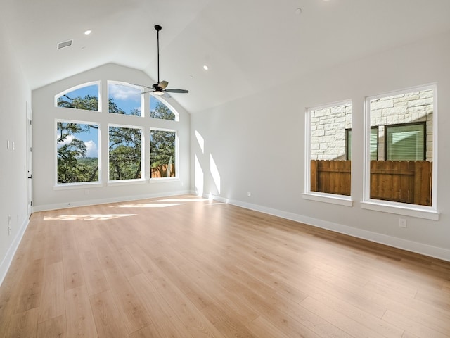 unfurnished living room featuring ceiling fan, light hardwood / wood-style floors, and vaulted ceiling