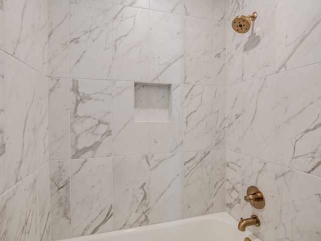 details with tiled shower / bath combo