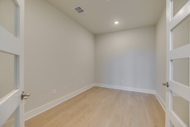 spare room with light hardwood / wood-style floors