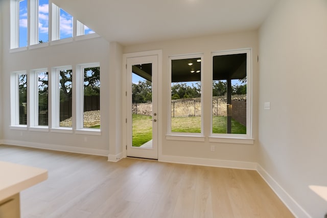 doorway to outside with light hardwood / wood-style flooring