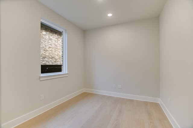 spare room with light hardwood / wood-style flooring