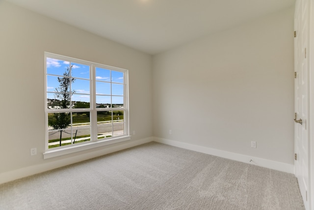 unfurnished room featuring carpet