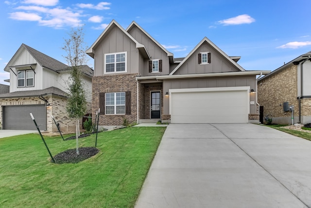 view of front of property with a front lawn and a garage