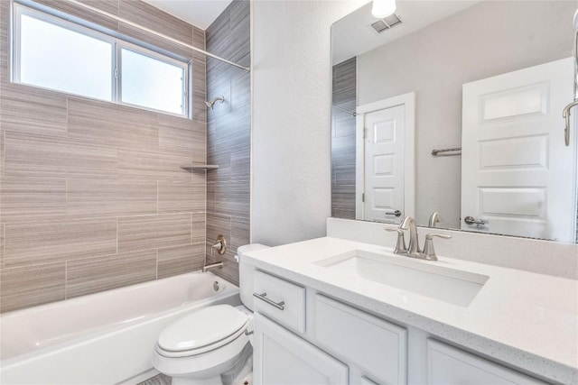 2016 Dinsdale Ln, Austin, TX 78741 - full bathroom featuring toilet, bathtub / shower combination, and vanity