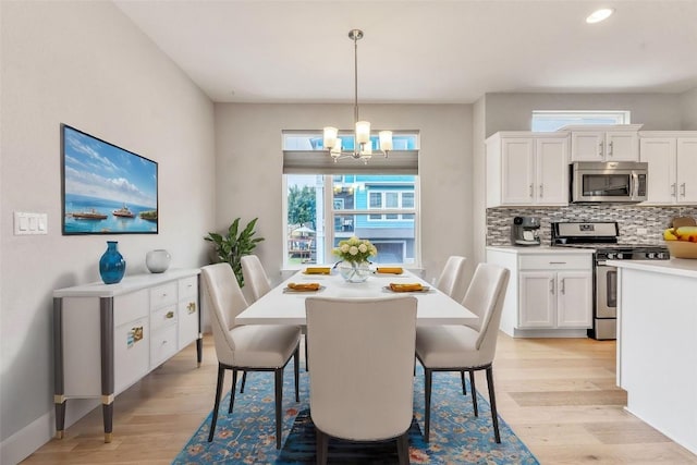 2016 Dinsdale Ln, Austin, TX 78741 - dining area with a chandelier, light wood finished floors, and recessed lighting