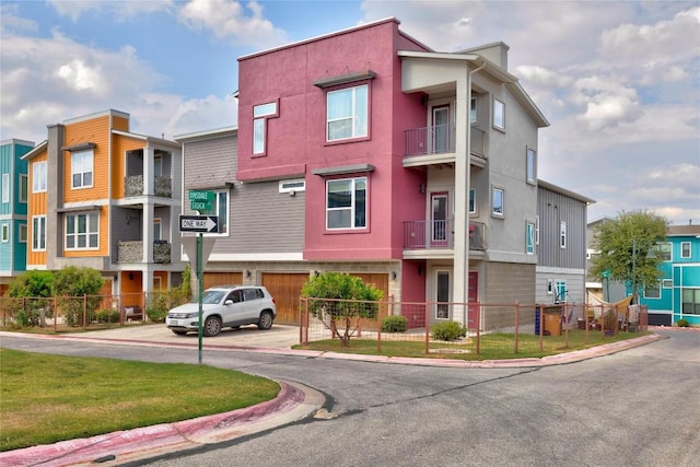 2016 Dinsdale Ln, Austin, TX 78741 - view of property featuring an attached garage and driveway