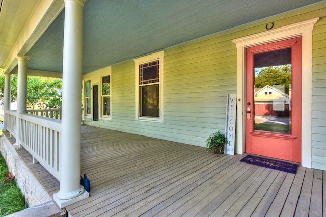 wooden terrace with a porch