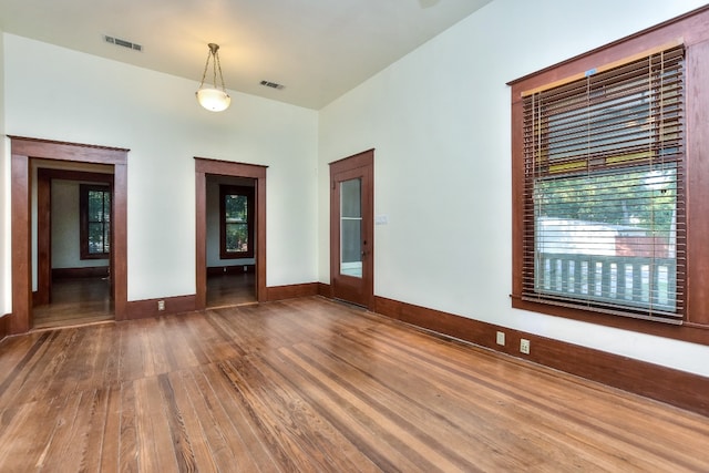 unfurnished living room featuring wood-type flooring