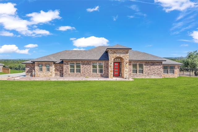 rear view of house with a yard