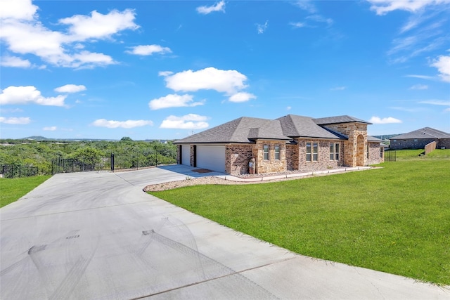 view of front of property featuring a garage and a front yard