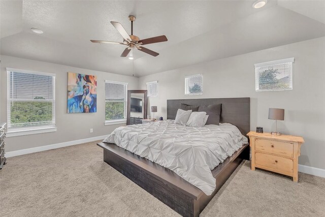 carpeted bedroom with lofted ceiling and ceiling fan