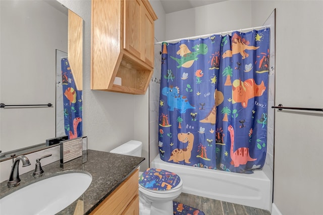 full bathroom featuring wood-type flooring, toilet, shower / tub combo, and vanity