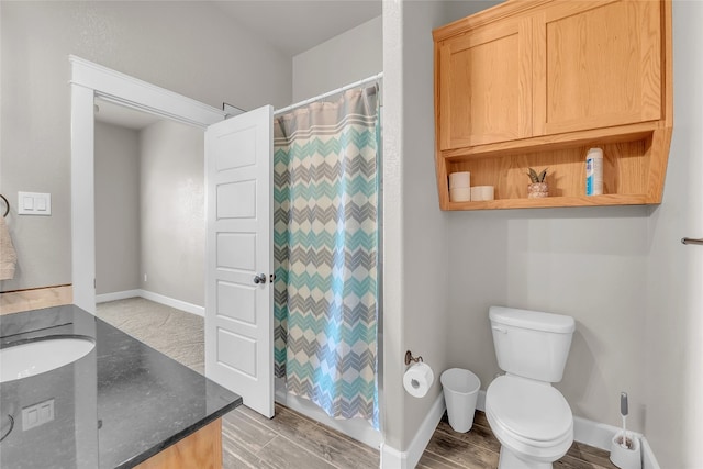 bathroom with toilet and vanity