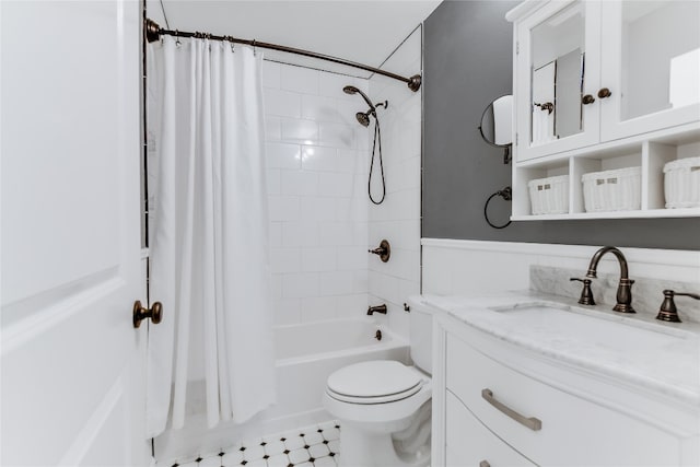 full bathroom featuring vanity, toilet, tile patterned floors, and shower / bath combo