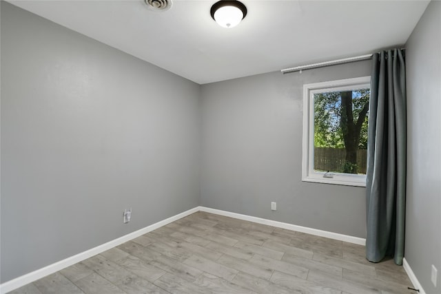 spare room featuring light hardwood / wood-style floors