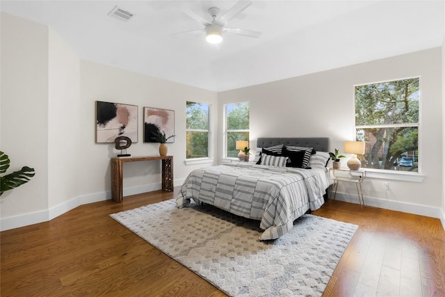 bedroom featuring hardwood / wood-style flooring and ceiling fan