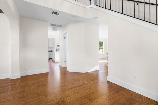 unfurnished room with hardwood / wood-style floors