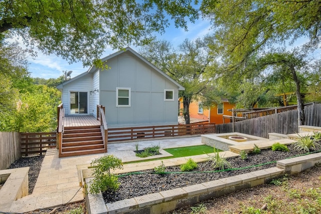 rear view of house with a patio area and a deck