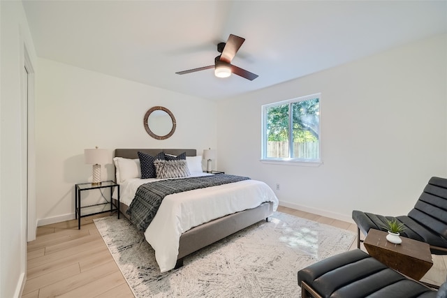 bedroom featuring ceiling fan and light hardwood / wood-style floors