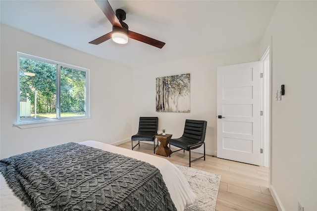 bedroom with light wood-type flooring and ceiling fan